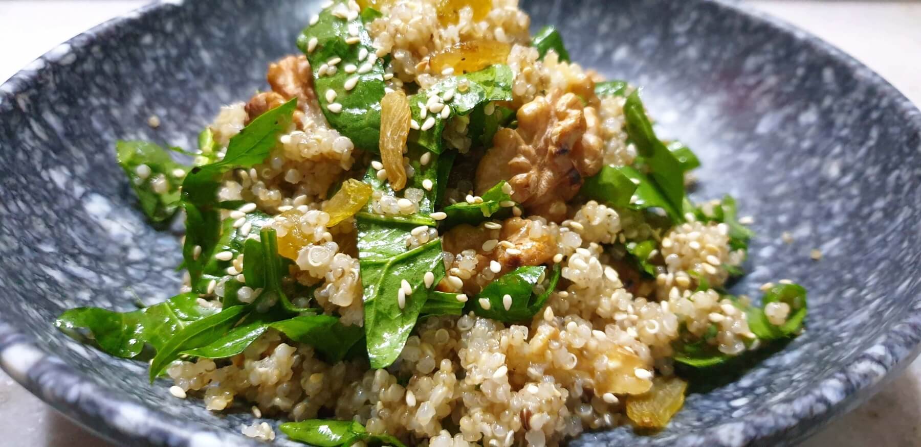 Walnut Raisin Quinoa Salad Spoon And Hand